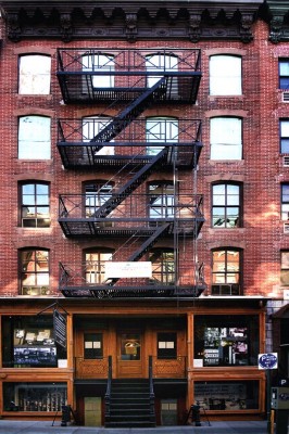 Figure 1: The exterior of the Lower East Side Tenement Museum.  The building was constructed using cheap materials and many apartments had no running water.<br />
(Image: Fletcher6, Creative Commons, 2012).